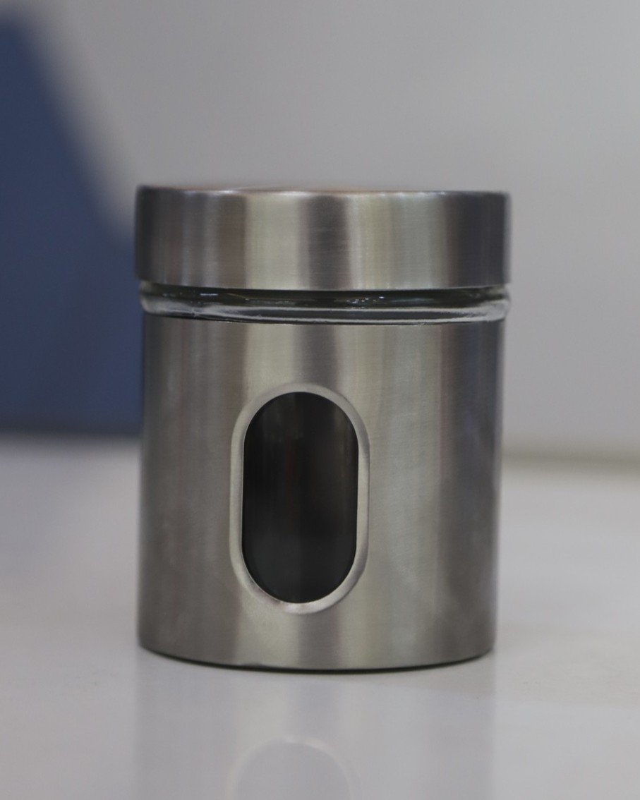 Glass jar with silver coverand lid