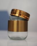 Glass jar with cover coated plastic cover
