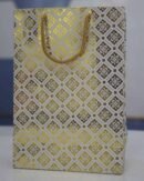 White paper bag with golden box design