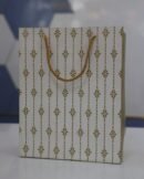 White & gold design paper bag