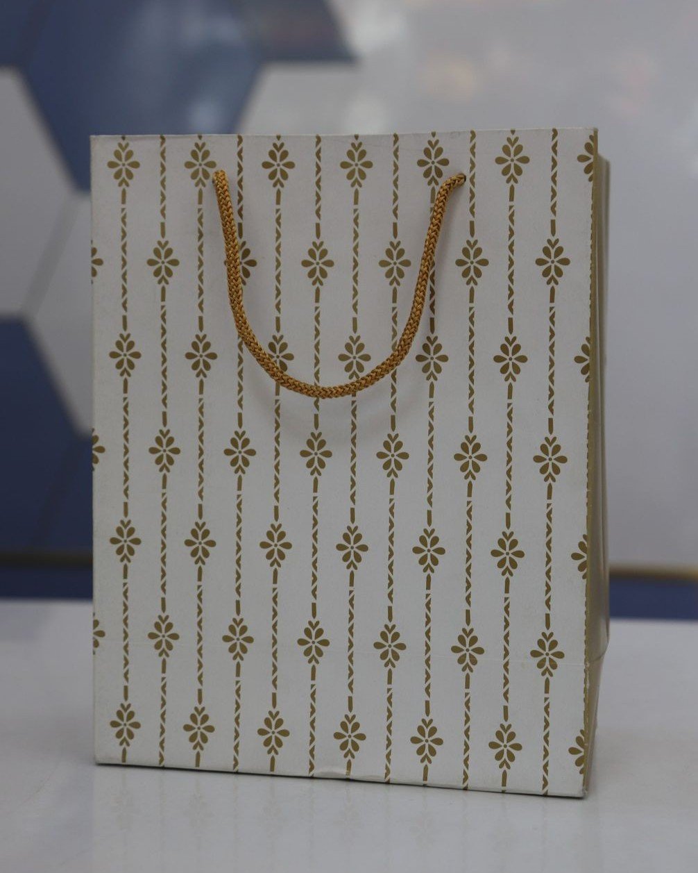 White & gold design paper bag