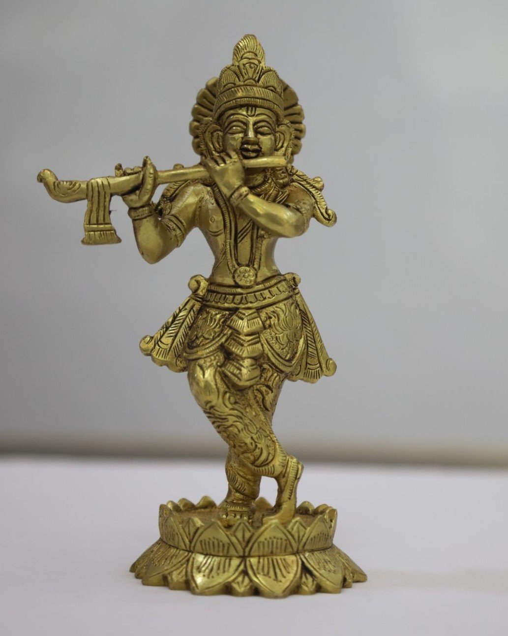 brass krishna idol
