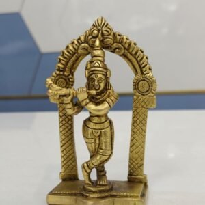 brass krishna idol with arch for puja room