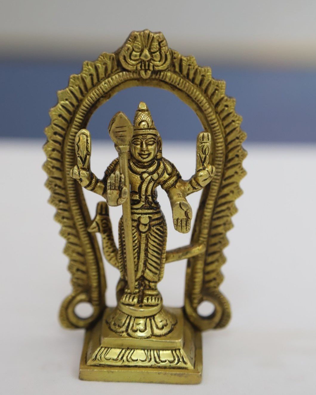 Brass murugan idol with arch