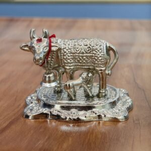 metal Kamadhenu statue with silver idol